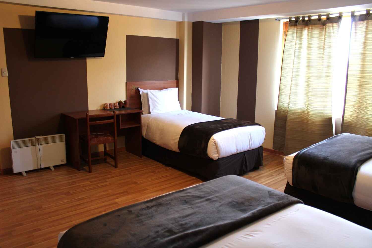 hotel-intiqa-puno-peru-habitacion-triple-vista-lateral